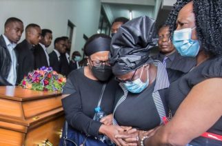 Florence Nyirenda, center, pays her respects during a memorial service for her son Lemekani Nyirenda, during his funeral at Lusaka Baptist Church, in Lusaka, Zambia, Jan. 24, 2023.