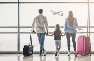 Family in airport. Attractive young woman, handsome man and their cute little daughter are ready for traveling! Happy family concept.; Shutterstock ID 1033801318; Purchase Order: -
