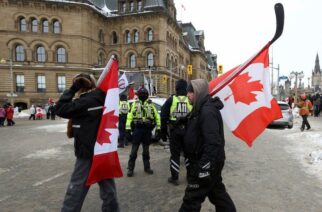 Police keep a watchful eye on protesters in Ottawa on Sunday